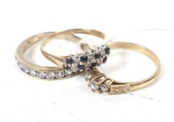 Three vintage 9ct gold and cubic zirconia rings.