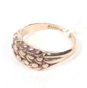 An early 20th century 9ct rose gold woven 'shot' ring. Hallmarks for Chester 1915, size O, 4.