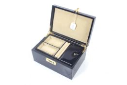 A navy-blue leather jewellery box.
