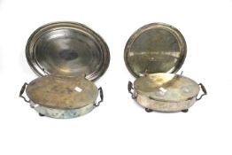 A pair of silver-plated oval 'heated' dish stands and two salvers.