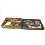 A collection of assorted silver-plated flatware in various patterns and other items.