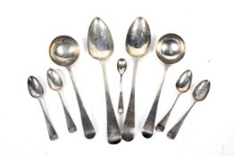 A small collection of George III and later silver old English pattern spoons.
