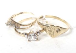 Three 9ct gold and cubic zirconia dress rings.