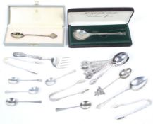 A small collection of miscellaneous small flatware in various mostly fancy patterns.