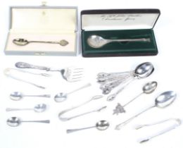 A small collection of miscellaneous small flatware in various mostly fancy patterns.
