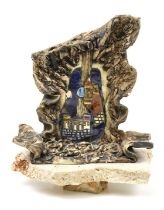 A 20th century Studio Art pottery sculpture. With guitar and castle decoration on plinth.