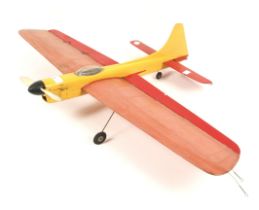 A single engine wooden tether plane.