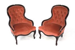A pair of button back nursing chairs.
