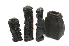 Four wooden tribal items. Comprising three figural carvings and a flask, Max.