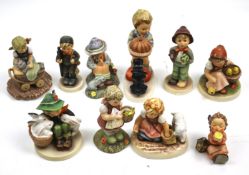 A collection of ten assorted Goebel figurines. Including 'Snuggle Up' BH 67 1998, etc.