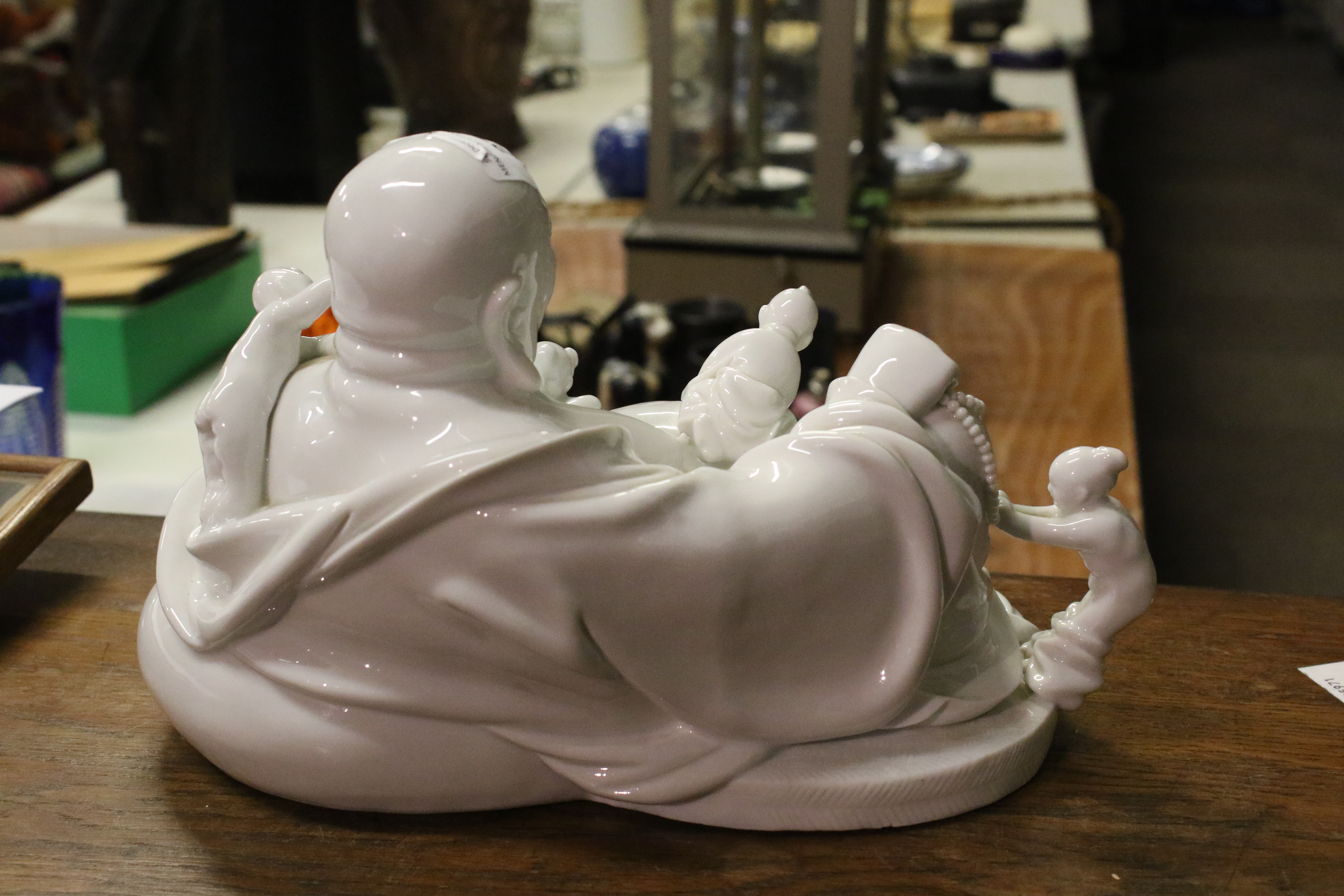 A 20th century Chinese Blanc de Chine figure of laughing Buddha with five children. - Image 4 of 17