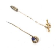 Two late Victorian/Edwardian gold and gem set stick pins.