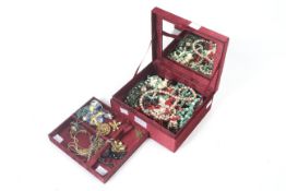 A collection of miscellaneous costume jewellery including various Singapore gilded orchids.