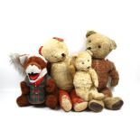 Four vintage teddy bears.