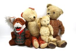 Four vintage teddy bears.
