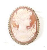 A vintage 9ct gold and oval shell cameo brooch depicting an unknown female profile.