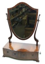 A mahogany Regency shield swing dressing mirror. With two drawers below in the bow front.