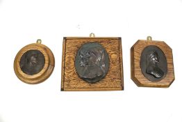 A collection of three assorted 'Dante' mounted metal plaques. Max. H14.