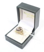A 9ct gold and oval citrine single stone ring.