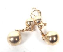 A pair of Italian gold spherical bead pendent earrings.