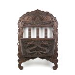 An Anglo- Chinese carved wooden newspaper wall rack.