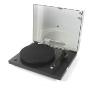 A Rega Planar 3 turntable record deck.