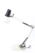 A retro Micromark swing arm adjustable desk lamp. White on a rectangular weighted base.