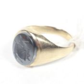 A vintage 9ct gold and oval hematite intaglio ring.