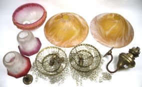 A collection of assorted glass light shades. Including ceiling shades and wall lights.
