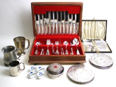 An assortment of silver plate and metalware. Including a canteen, mugs, coasters, etc.