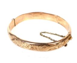 An early 20th century 9ct rose gold hollow hinged bangle.