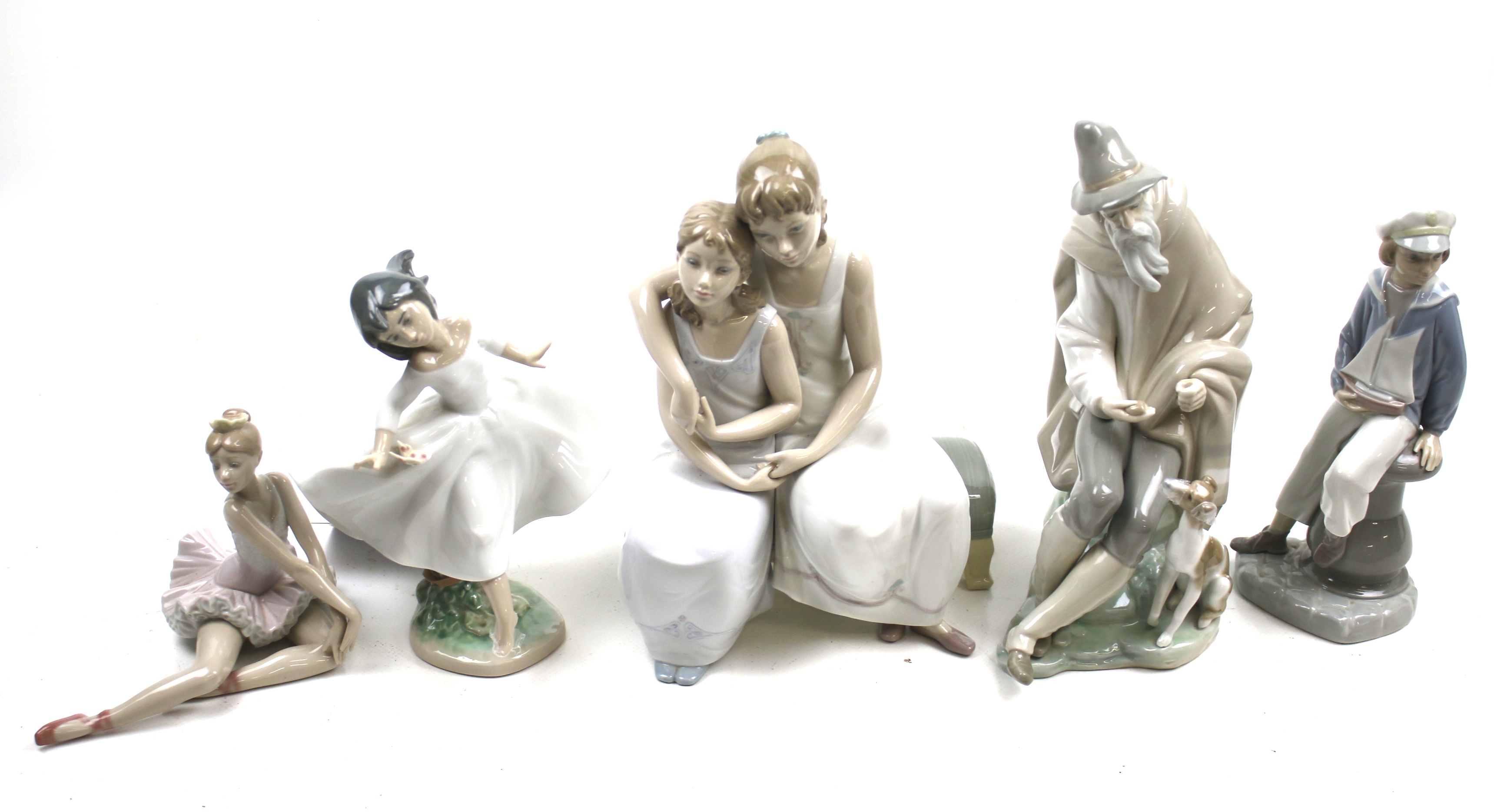 A collection of five Lladro porcelain figures. Including young ballerina and young sailor boy, etc.
