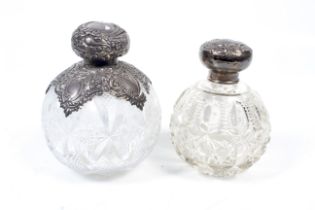 Two silver mounted clear cut-glass scent bottles.