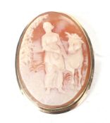 A vintage gold and oval shell cameo brooch depicting Europa and Zeus in the form of a bull.