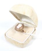 A modern 9ct gold and oval shell cameo ring.