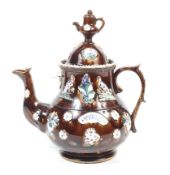 A Victorian bargeware teapot.
