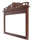 A French Art Nouveau mahogany wall/overmantel mirror with carved and pierced cresting.