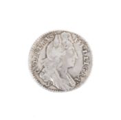 A 1696 York sixpence coin. Lightly cleaned.