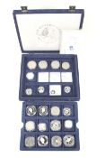 20 silver coins from £1 to crown size. In a blue case with certificates.