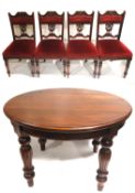 A Victorian mahogany circular extending dining table ( with extra leaf) together with 4 late 19 th