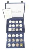 23 mainly crown size silver coins. In a blue case with certificates.
