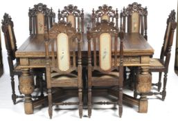 A 20th century, Charles II style extendable table and eight Victorian Jacobean style chairs.
