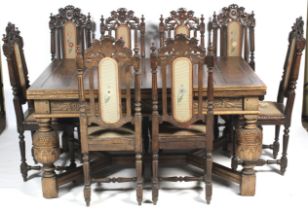 A 20th century, Charles II style extendable table and eight Victorian Jacobean style chairs.