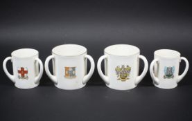 Four large WH Goss tyg loving cups.