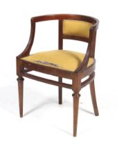 A circa 1900 Italian mahogany open armchair with stuffed back rest and sprung seat.