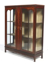 An Edwardian mahogany and string inlaid display cabinet.