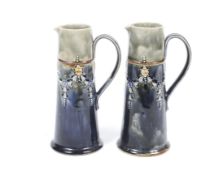 A pair of Royal Doulton Lambeth jugs.