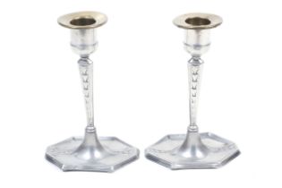 A pair of circa 1900 German Art Nouveau WMF candlesticks.