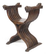 A 19th Renaissance style walnut 'Savonarola' scissor throne chair.