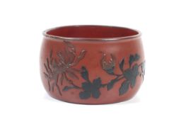 A 19th century Japanese red lacquer pot.